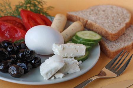 Dietary breakfast consisting of eggs, cheese and olivesの写真素材