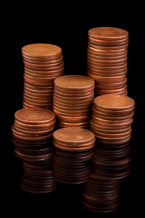 Money coin columns reflecting in the dark
