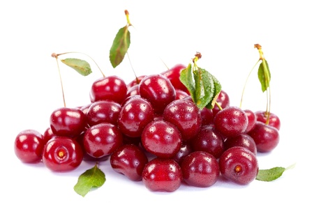 A heap of wet cherries on white background