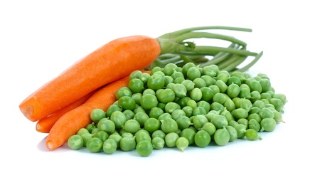A bunch of peas and carrots over white backgroundの写真素材