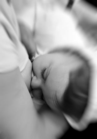 Mother breast-feeding her baby