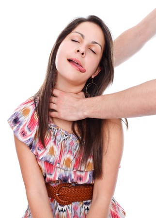Hand choking young girl's neck, studio shot
の写真素材
