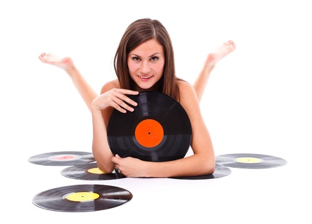 Nude girl lying on the floor with vinyl disc in her hand
の写真素材