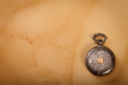 Beautiful old artisan pocket watch on papyrus background
の写真素材