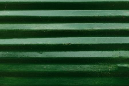 Green colour corrugated metal sheet backgroundの写真素材