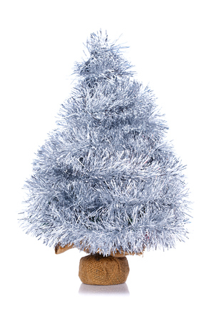 Small Christmas tree made of silver garland isolated on white backgroundの写真素材