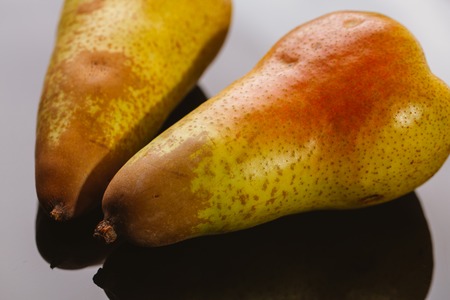 several fresh pear on a dark background.の写真素材