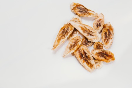 Dried fresh banana on a white background.の写真素材