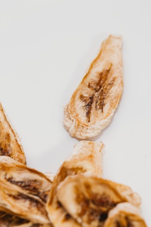 Dried fresh banana on a white background.の写真素材
