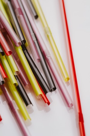 colored tubules for a cocktail on white background.の写真素材