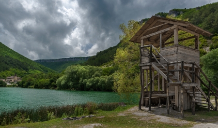 Wooden tower of supervision near a mountain lake, to prevent an accidentの写真素材
