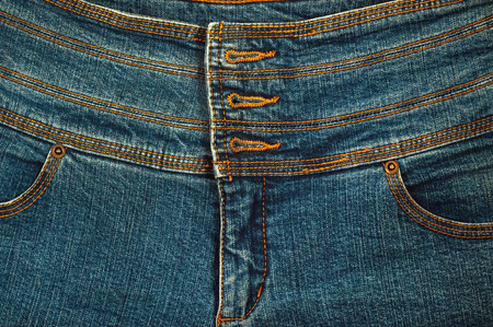 Texture of a background of jeans, a belt