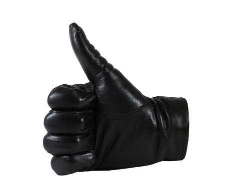 Men's black leather gloves isolated on white backgroundの写真素材