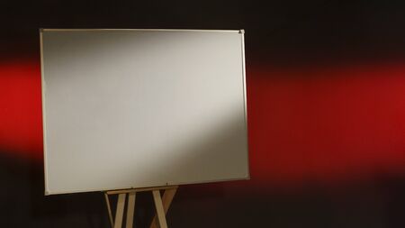 White taskboard on abstract black and red backgroundの写真素材