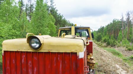 View of a part of narrow gauge railway locomotive on forest background. Extraction and transportations of peat.の写真素材