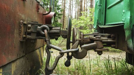 Top view of the hitch between two railways wagon. Business concept.