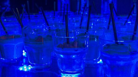Classic blue cocktails at the bar. Party cocktails and longdrinks. Alcohol and drinks concept.の写真素材