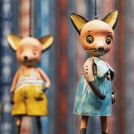 ?harming handmade toy girl-fox on a blurred background with other toys. Handmade and craft conceot.の写真素材