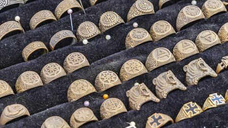 Bronze rings with old runes and magic symbol. Mystery concept.の写真素材