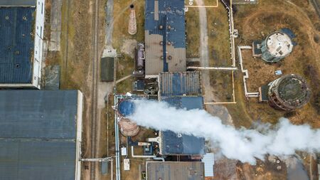 Aerial view smoking chimney of the gas boiler plant. Ecological problem.