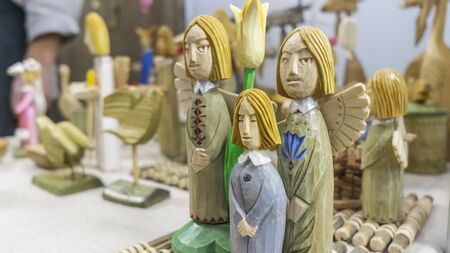 Wooden toys of angels. Folk art and craft concept.