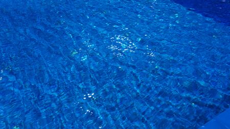 Classic blue pool water. Trendy colour 2020 year. Classic blue background.の写真素材