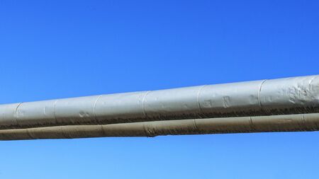 Industrial pipeline with gas and oil on classic blue sky background. Abstract concept. Space for...