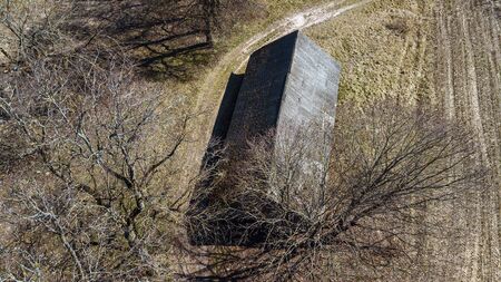 Aerial view of the old residential private house on the trees and agriculture field background. Rural life concept. Space for text.の写真素材