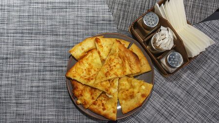 Georgian dish - Megrelian khachapuri. As a filling, young imeritin cheese is used. The salt and...