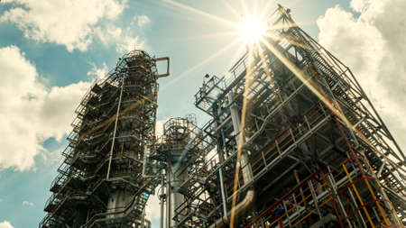 Petrochemical refinery plant. Industrial towers at oil refinery. Oil refinery twilight on classic blue sky background.の写真素材