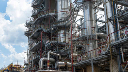 Petrochemical refinery plant. Industrial towers at oil refinery. Oil refinery twilight on classic...