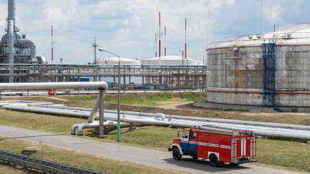 Fire truck in industrial plant. A large red fire rescue vehicle in the chemistry refinary plant on...