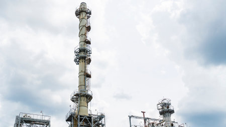 Industrial furnace and heat exchanger cracking hydrocarbons in a factory on blue sky