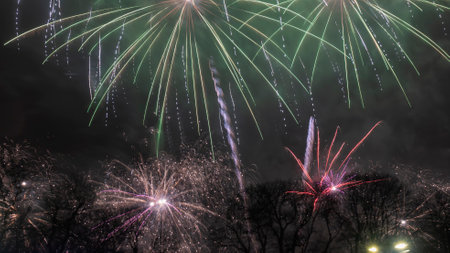 A long exposure showing multiple firework explosions. Fireworks celebration. Photography of a salute shot at long exposure.の写真素材