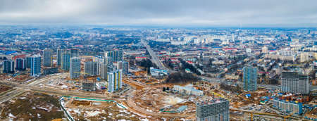Construction of high-rise resedential buildings. The construction industry with working equipment. View from above.の写真素材