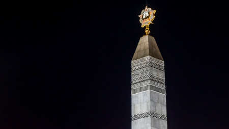 Monument of Victory in the center of Minsk at the night. A memorable place in honor of the heroism of the people during the Great Patriotic War. Heroism concept.の写真素材