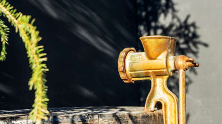 Close-up view of the old design manual meat grinder on the outdoor.