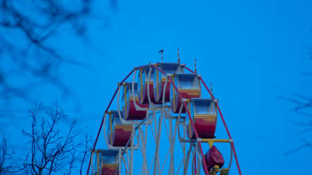 Close up some part of Ferris Wheel at evening time. Big observation wheel on the dark blue sky background. Holiday concept.の写真素材