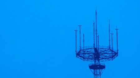 TV tower and skyline at dusk. Low Angle View Of Communications Tower Against Clear Sky.の写真素材