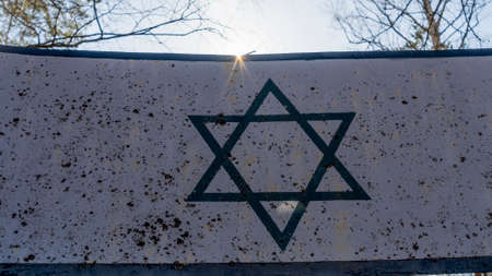 Symbol of Judaism or Star of David. Six-pointed star in a center of composition in beams of the sun.の写真素材