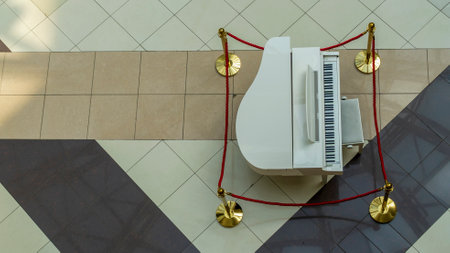 White grand piano in shopping center. Image for design. Space for text.の写真素材