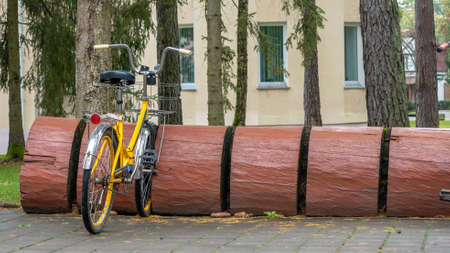 Rustic bike rack. Bicycle Parking Stand Made From the Trunk. bicycle parking was made from a large log. Sustainable concept.の写真素材