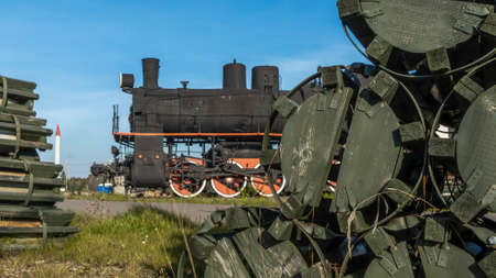 Retro Soviet steam locomotive. Veteran railways. Vintage black steam locomotive train rush railway. Historical railroad concept.の写真素材
