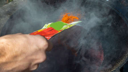 Mulled wine in a large cauldron. Mulled wine is cooked in a large pot. Vitamins in the traditional...