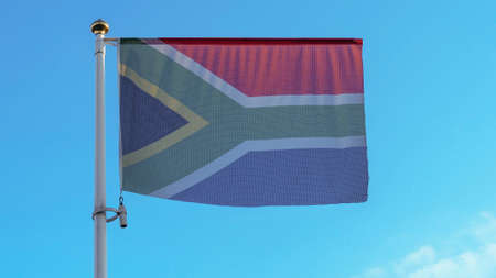 National flag of South Africa on a flagpole in front of blue sky with sun rays and lens flare. Diplomacy concept.の写真素材