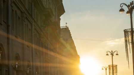Panoramic view of silhouettes of buildings and street lights at sunset in the historical center of city. Urban concepts.の写真素材
