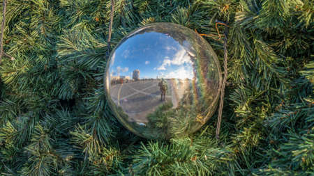 Festive mood during everyday life. The Christmas pine tree decoration on the street. Space for text. Xmas concepts. Festive street decoration.の写真素材
