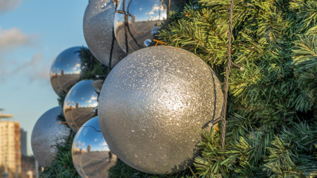 Festive mood during everyday life. The Christmas pine tree decoration on the street. Space for text. Xmas concepts. Festive street decoration.の写真素材