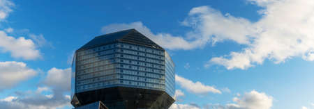 Public place. A large blue conceptual beautiful glass building National library of Belarus on blue...