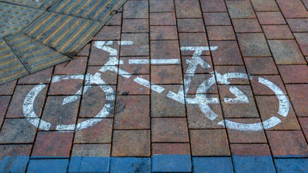 Bicycle sign on the road. Bike lane on the pavement. Road Bike detail. Ecological transport...